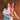 Two girls laughing and walking together down the street in their Sherpani bags.