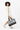 Model holding the Sherpani Boston AT in Sakura in her right hand, turning slightly to her right. #color_sakura