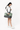 Model wearing the Sherpani Boston AT in Basil, across her chest with the strap over her left shoulder, turning her body to the right. #color_basil