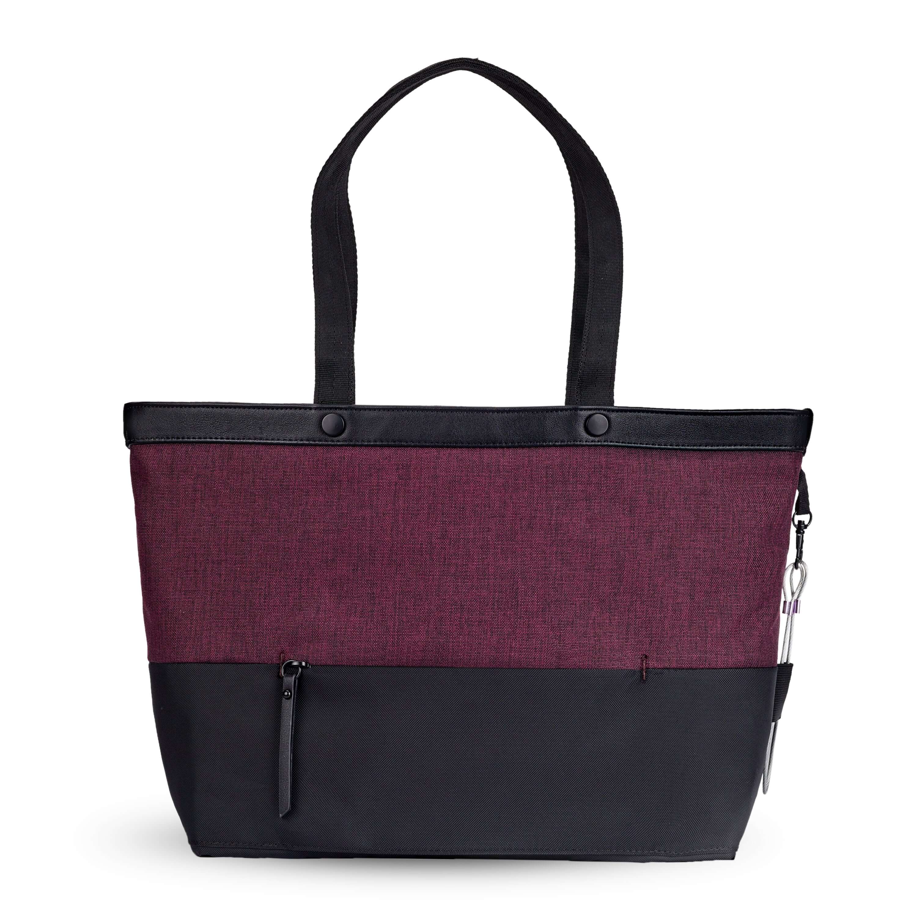 Back view of Sherpani's Anti-Theft tote, the Cali AT in Merlot, with vegan leather accents in black. There is a zipper compartment that acts as a luggage pass-through or trolley sleve, and a chair loop lock on one side that is secured by an elastic tab. 