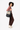 A model carries Sherpani three-in-one bag, the Camden in Con Leche, as a tote. #color_con-leche