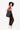 A model carries Sherpani three-in-one bag, the Camden in Raven, as a tote. #color_raven