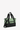 Angled front view of Sherpani Anti-Theft bag, the Eclipse AT in Basil. The bag features a soft green front panel with black accents. This Anti-Theft expandable tote includes security features for safe travels and an adjustable crossbody strap that can convert the Eclipse to a left-handed design. #color_basil