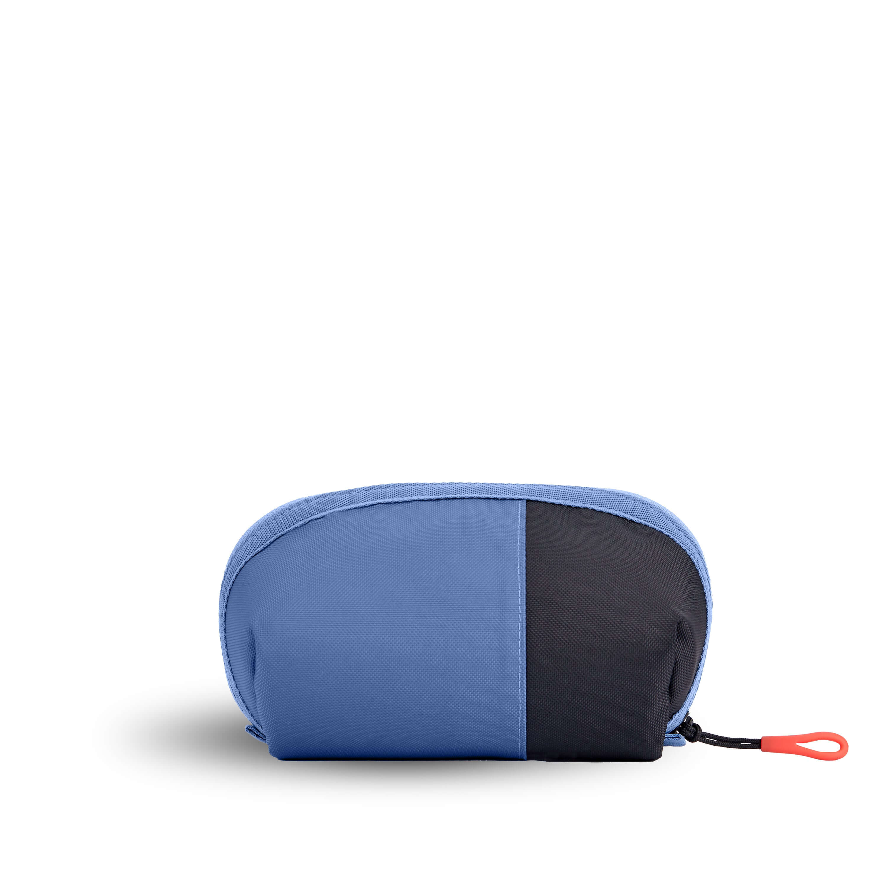 Back view of Sherpani travel accessory the Harmony in Pacific Blue. The pouch is two toned in ocean blue and black. 