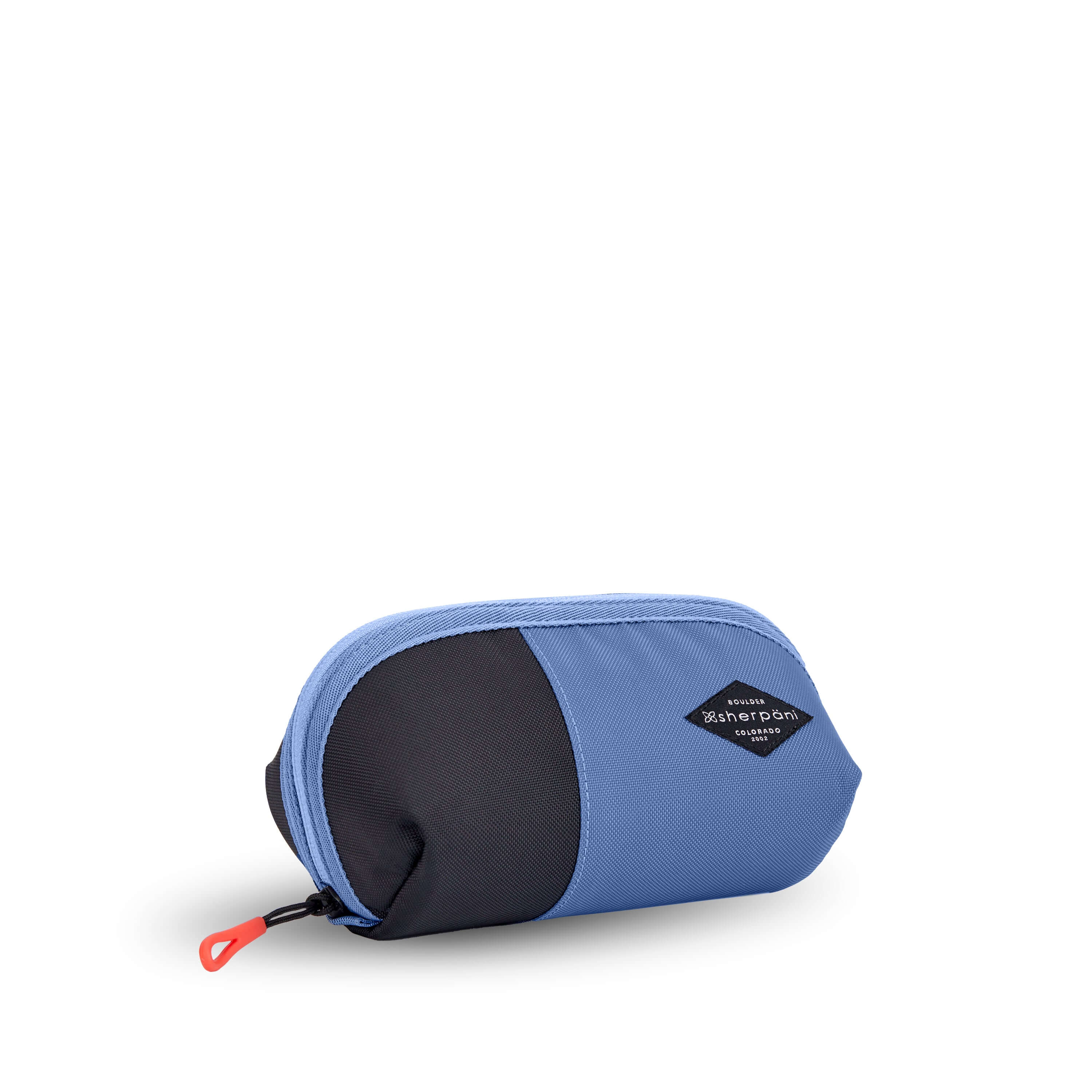 Angled front view of Sherpani travel accessory, the Harmony in Pacific Blue. The pouch is two toned in ocean blue and black. It has an easy pull zipper that is accented in red. 