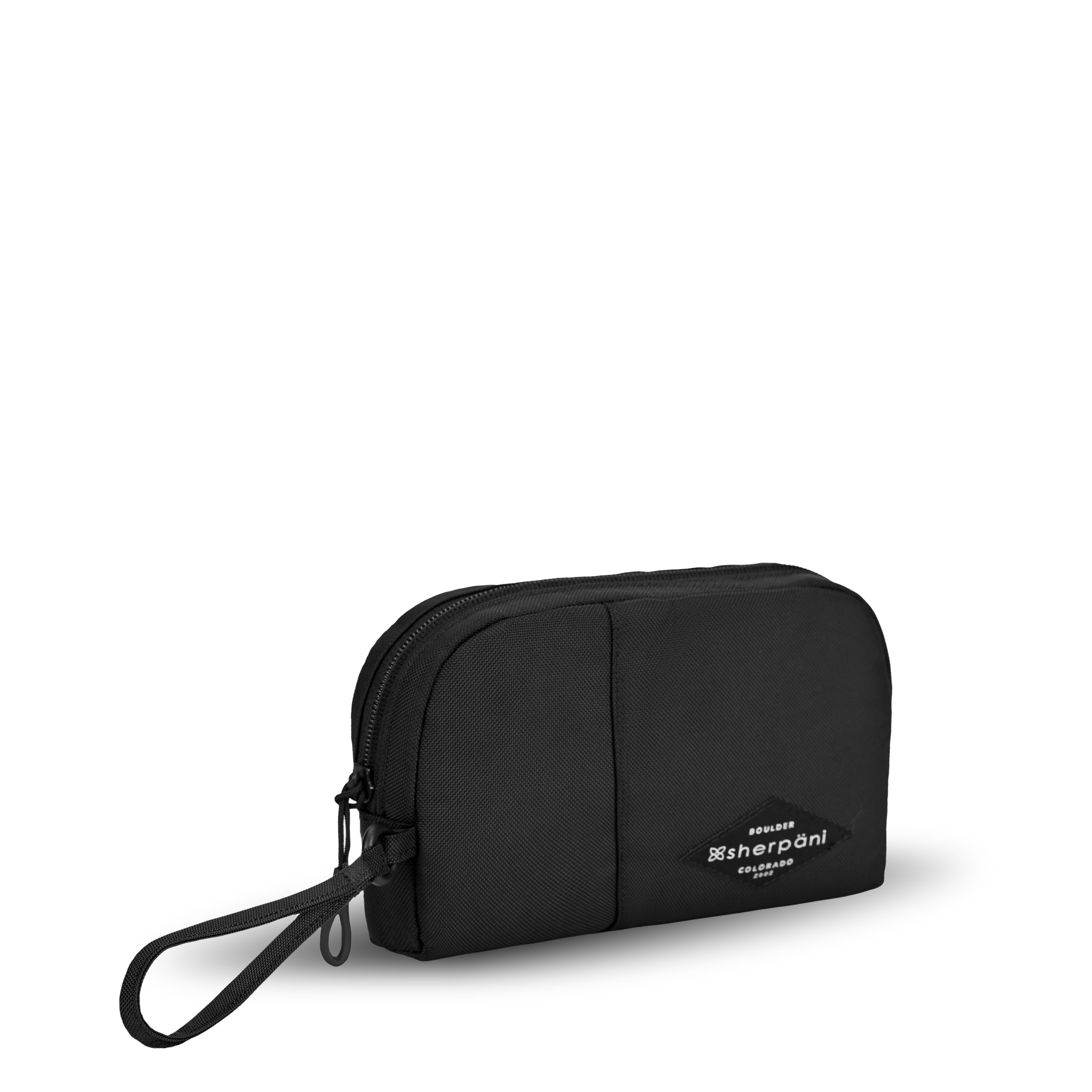 Angled front view of Sherpani travel accessory, the Jolie in Raven, in medium size. The pouch is entirely black. It features a black wristlet strap and an easy-pull zipper accented in black. 