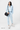 Model wearing the Sherpani crossbody, the Mina in Chromatic, as a shoulder bag #color_chromatic