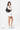 Model wearing with the Sherpani crossbody, the Mina in Raven, as the shoulder bag #color_raven