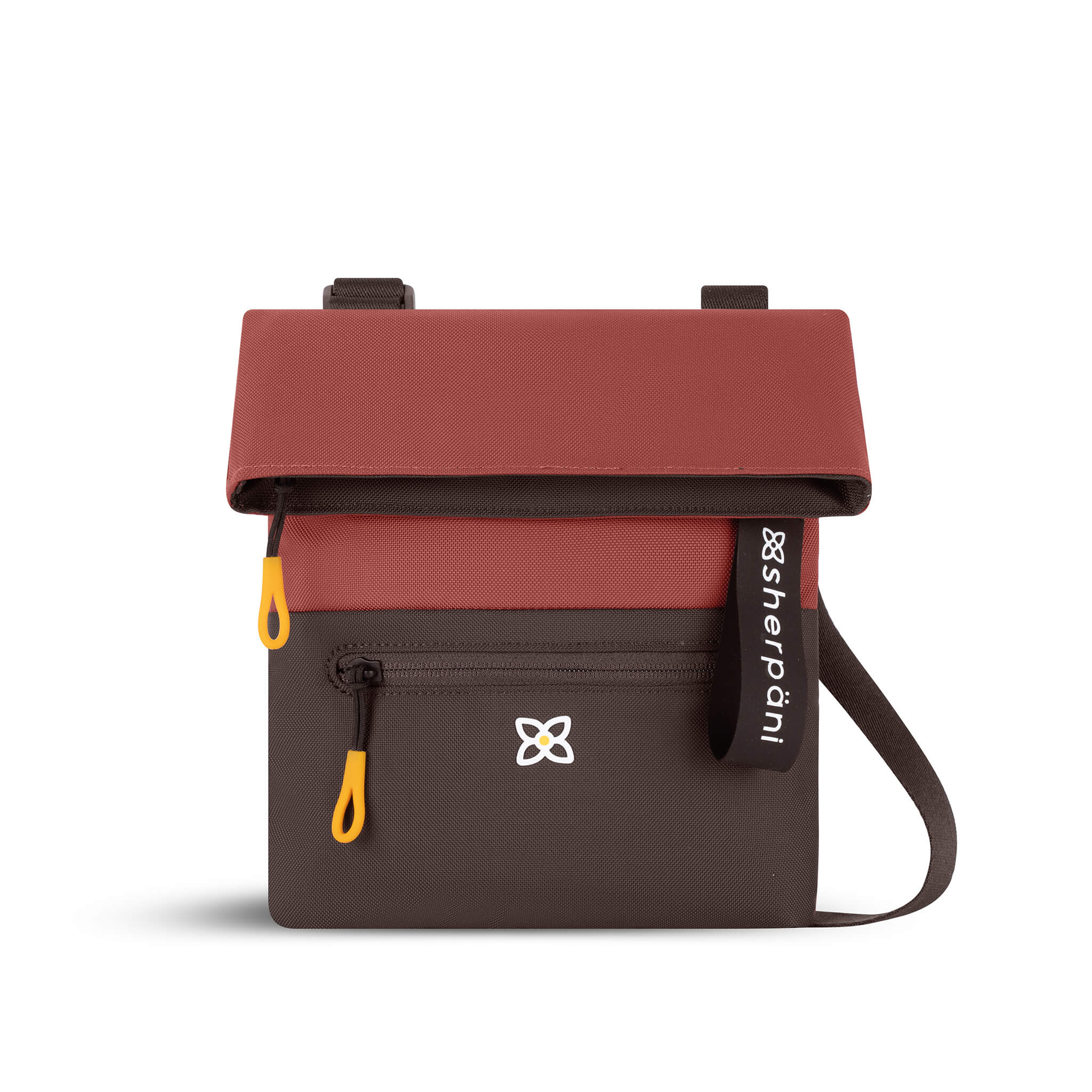 Flat front view of Sherpani fold over crossbody bag, the Pica in Cider. Pica features include an adjustable crossbody strap, outside zipper pocket, back flap pocket, inside zipper pocket and slip pocket, detachable keychain and RFID protection. The Cider color is two-toned in burgundy and dark brown with Sherpani logo (edelweiss flower) accented in white. 