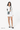 A model carries Sherpani crossbody, the Milli in St. Lucia, as a shoulder bag. #color_st-lucia