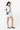 Model turned slightly to the side, wearing the Sherpani crossbody, the Rogue in St. Lucia. #color_st-lucia