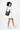 Model turned slightly to the side, wearing the Sherpani crossbody, the Sadie in Chromatic. #color_chromatic