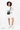 A model carries Sherpani crossbody, the Sadie in Magnolia, as a crossbody. #color_magnolia