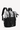 Model carries Sherpani three-in-one bag, the Sedona in Magnolia, as a backpack. #color_magnolia