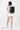 Model wearing the Sherpani Tempest AT in Carbon on her back. #color_carbon-metal
