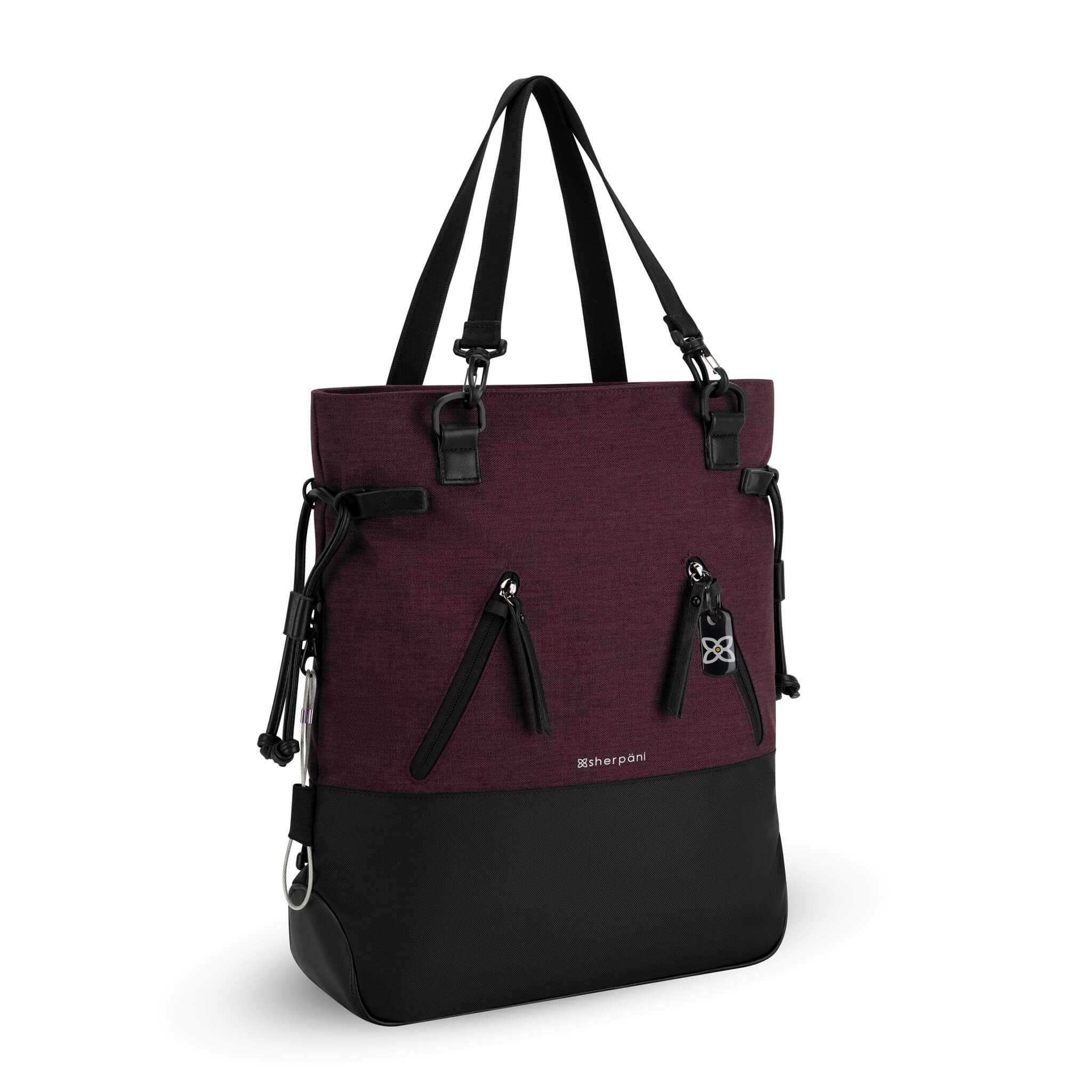 Angled front view of the Sherpani Anti-Theft tote backpack, the Tempest in Merlot. The convertible bag includes RFID protection, locking zipper pockets, adjustable straps, and a trolley sleeve. 