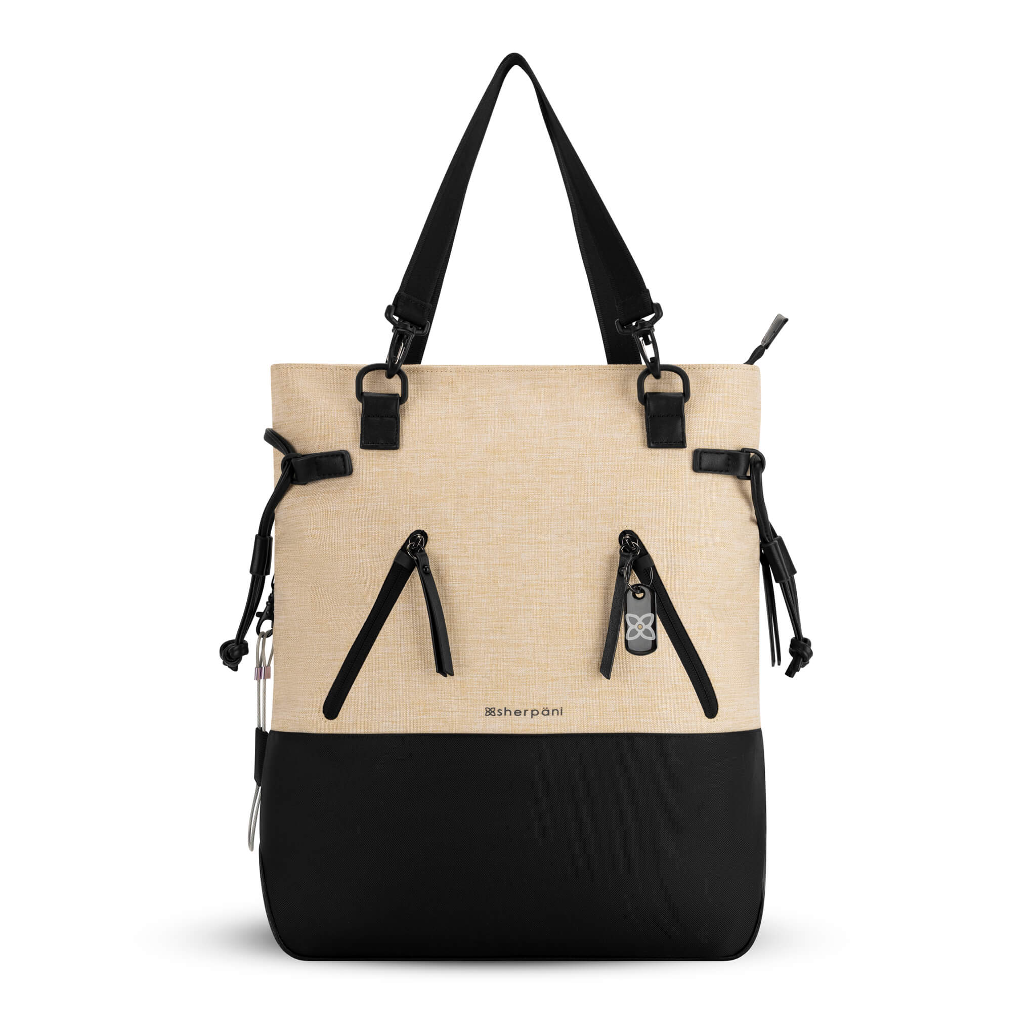 Flat front view of the Sherpani Anti-Theft tote backpack, the Tempest in Straw. The convertible bag includes RFID protection, locking zipper pockets, adjustable straps, and a trolley sleeve. 