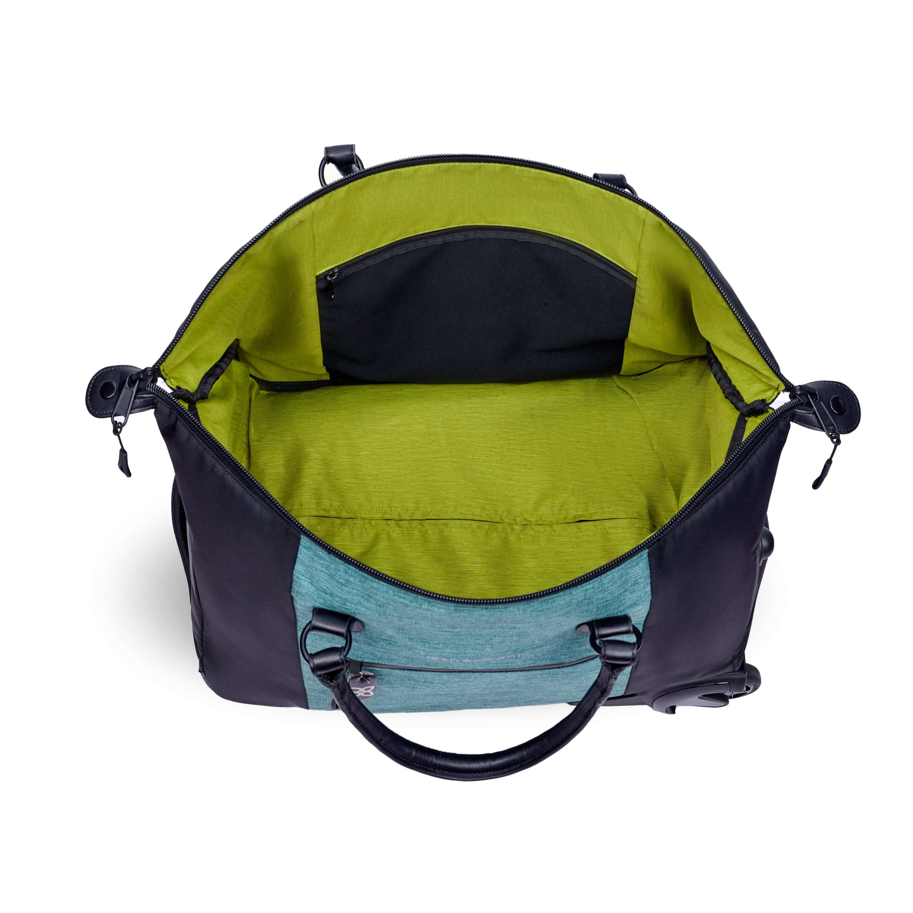 Top view of Sherpani’s Anti-Theft rolling duffle the Trip in Teal. The main zipper compartment is open showcasing a wide mouth and revealing a lime green interior with an internal zipper pocket. 
