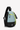 Angled front view of Sherpani two-way sling bag, the Wayfarer in St. Lucia. The bag is two-toned: the top is an aqua blue color with an accented in light green, and the bottom is black. There is an external zipper pocket on the front panel and a main zipper compartment. A branded Sherpani keychain is clipped to the upper right corner. The sling strap can unzip to convert the bag into a backpack. #color_st-lucia