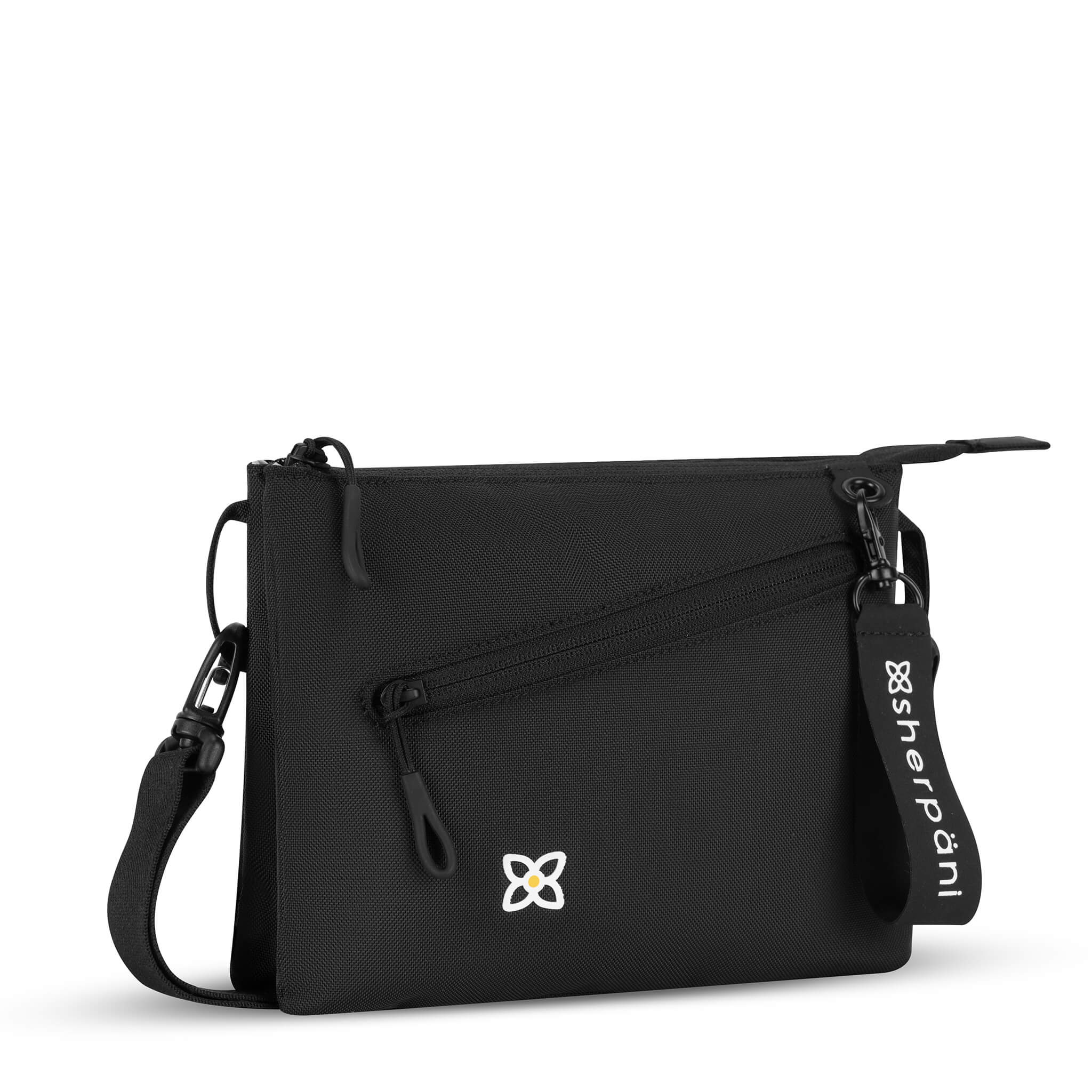 Angled front view of Sherpani small crossbody bag, the Zoom in Raven. Special features of the Zoom include RFID protection, adjustable crossbody strap, removable strap, removable keychain, outside zipper pocket, internal divider, internal zipper pockets and back slip pocket. The Raven color is solid black with Sherpani flower logo accented in white. 