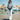 Young woman walking on a dock with a Sherpani sling bag.