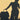 Shadow of person taking picture shown is their silhouette and the silhouette of luggage and a weekender bag.