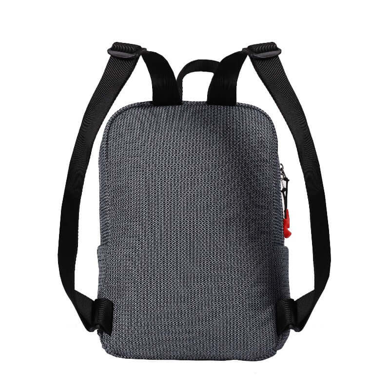 Back view of Sherpani mesh backpack, the Adaline. It has a gray and black mesh pattern and features red pops of color on the accent buckle and easy-pull zipper. The bag has black adjustable backpack straps and a tote handle for easy carrying.