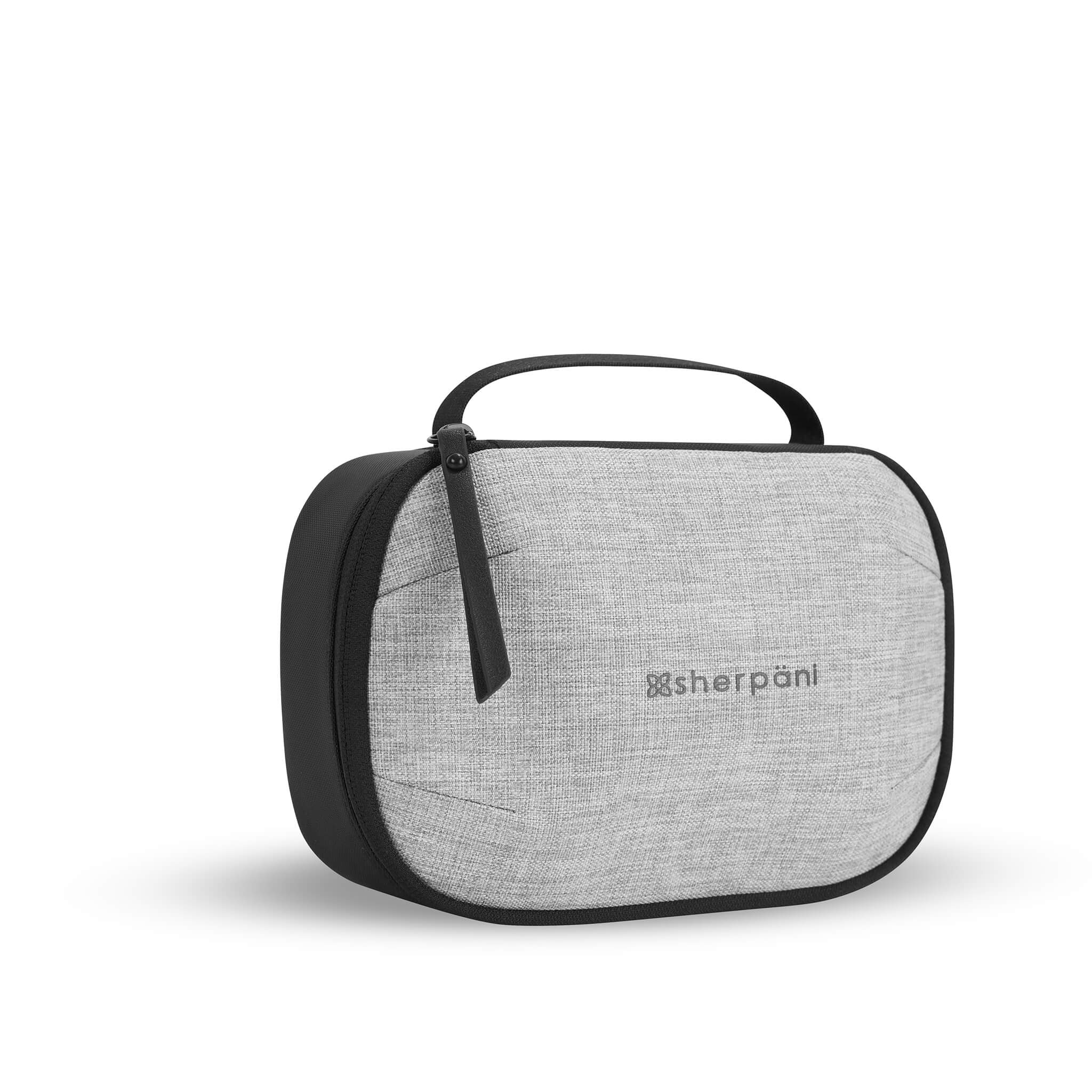 Angled front view of Sherpani travel accessory the Atlas in Sterling. The Atlas doubles as a toiletry bag and a tech pouch. #color_sterling #color_sterling