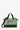 Flat front view of Sherpani Anti-Theft bag, the Boston AT in Basil. The bag features a soft green front panel with black accents. There is an external pouch on the front of the bag. The bag features an adjustable crossbody strap. #color_basil