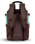 Back view of Sherpani's three-in-one bag, the Camden in Seagreen. The back of the bag is entirely brown. An elastic water bottle holder sits on either side of the bag. The bag has padded/adjustable backpack straps and short tote handles fixed at the top.