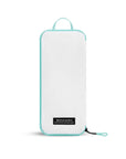 Flat front view of Compass Packing Cube in small size. The cube is white with zipper and handle accented in aqua.