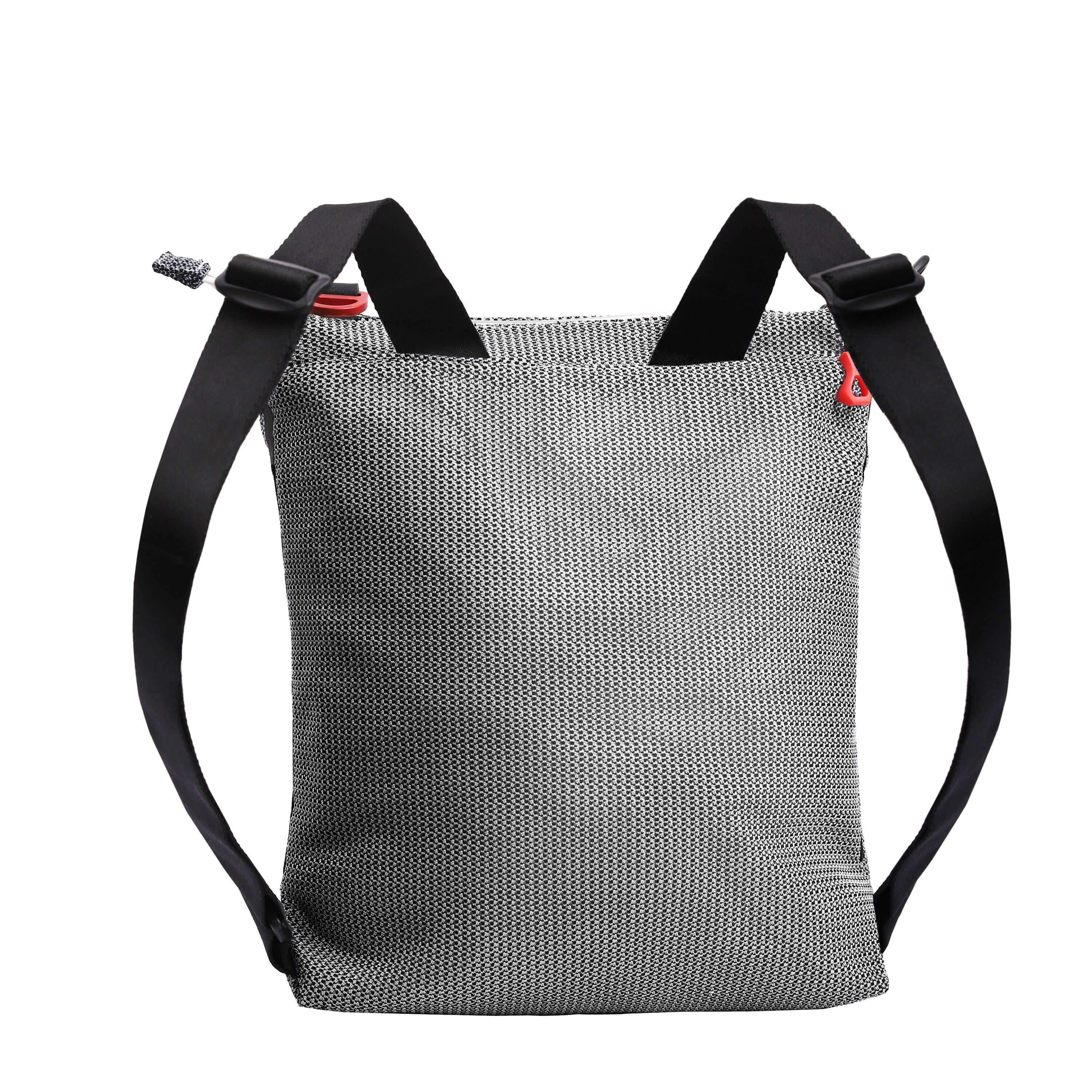 Back view of Sherpani convertible mesh bag, the Delanie. It has a black and white mesh pattern and features pops of red on the accent buckle and easy-pull zipper. The bag has adjustable backpack straps and an adjustable/detachable crossbody strap.
