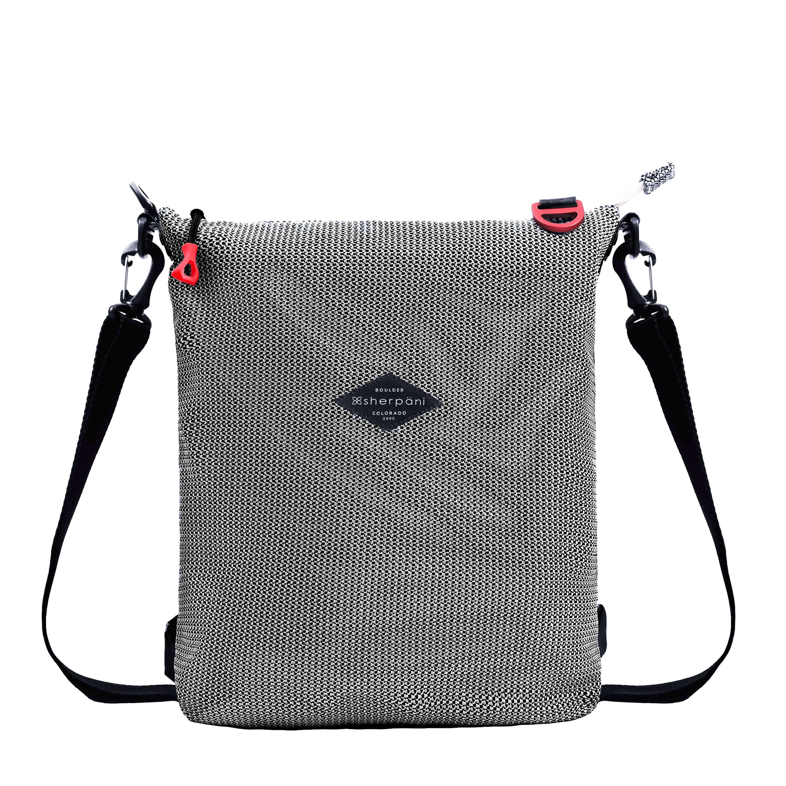 Flat front view of Sherpani convertible mesh bag, the Delanie. It has a black and white mesh pattern and features pops of red on the accent buckle and easy-pull zipper. The bag has adjustable backpack straps and an adjustable/detachable crossbody strap.