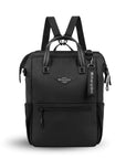 Flat front view of Sherpani three-in-one bag, the Dispatch in Raven. The bag is entirely black. There is an external zipper pocket on the front panel. Easy-pull zippers are accented in black. A branded Sherpani keychain is clipped to the upper right corner. Elastic water bottle holders sit on either side of the bag. It has short tote handles and adjustable/detachable straps that can function for a backpack or crossbody.
