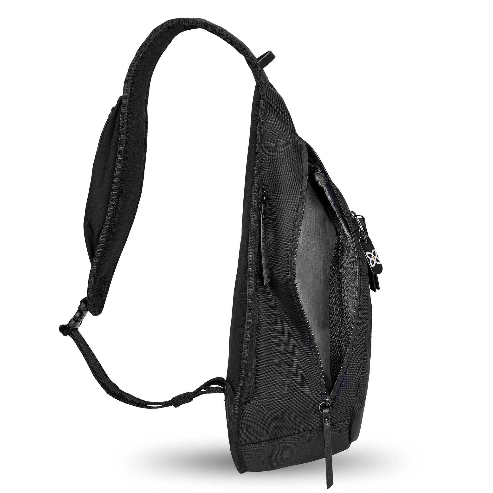 Side view of Sherpani’s Anti-Theft bag, the Esprit AT in Carbon, with vegan leather accents in black. The main zipper compartment is open to reveal a lime green interior. 