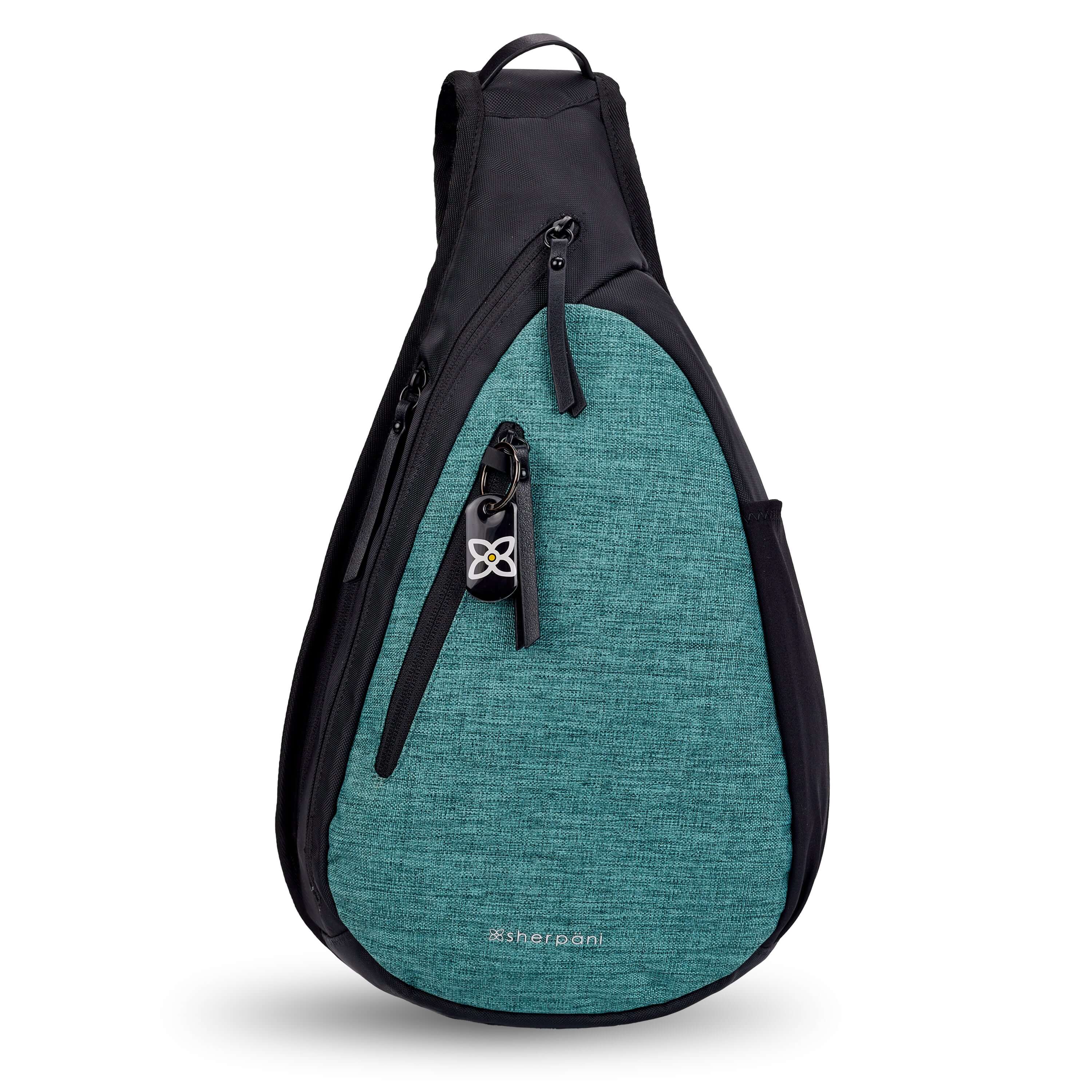 Flat front view of Sherpani&#39;s Anti-Theft bag, the Esprit AT in Teal, with vegan leather accents in black. There is a locking zipper compartment on the front, and two more zipper compartments on the side. An elastic water bottle holder sits on the other side of the bag.