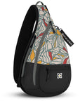 Angled front view of Sherpani sling backpack for women, the Esprit in Fiori. Esprit features include front zipper pocket, side zipper pocket, inside mesh pocket, RFID blocking, detachable key chain and an adjustable sling strap. The Fiori colorway is two-toned in black and a floral patter with red accents.
