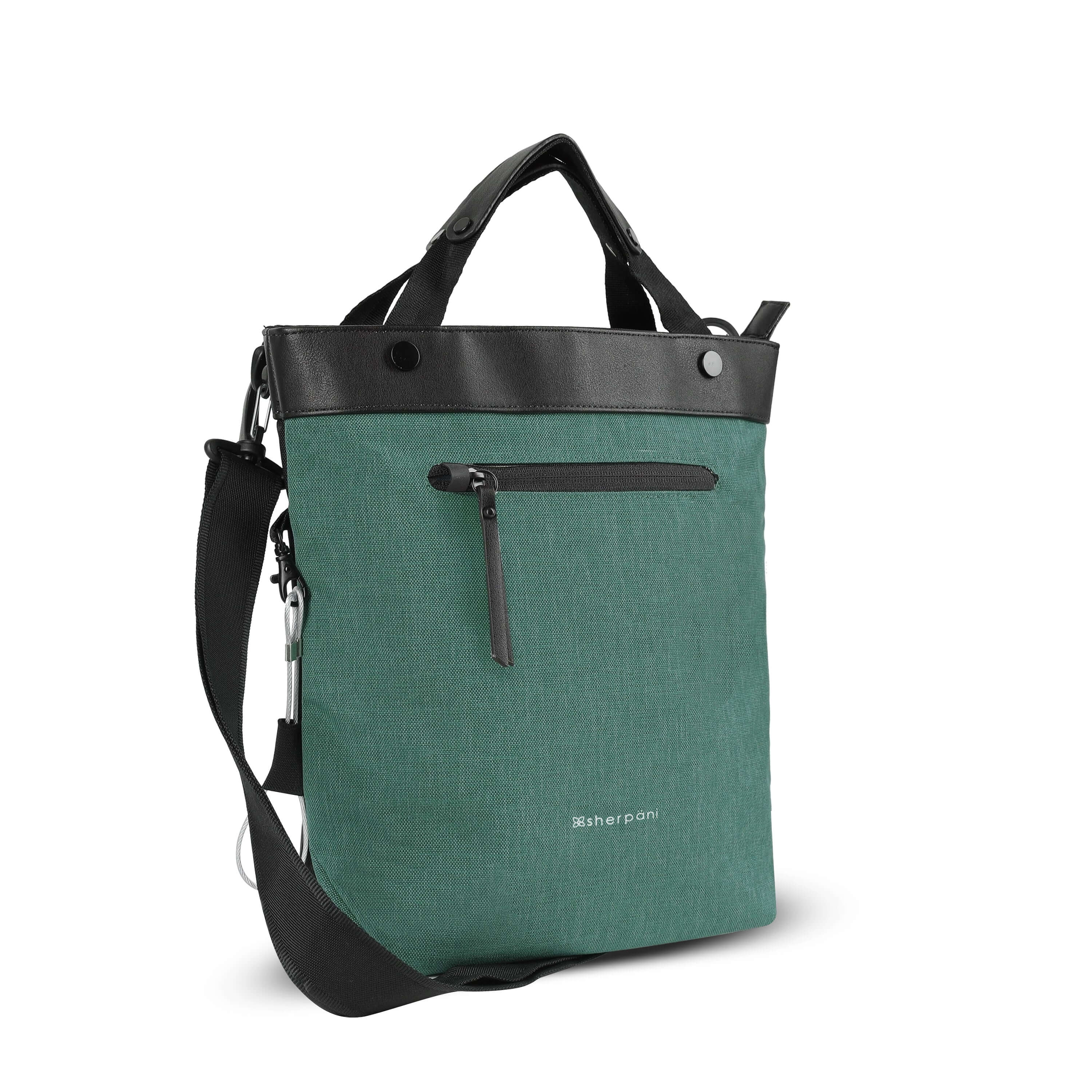Angled front view of Sherpani&#39;s Anti-Theft bag, the Geo AT in Teal, with vegan leather accents in black. The bag features short tote handles and an adjustable/detachable crossbody strap. There is a locking zipper compartment on the front. A chair loop lock is clipped to the side and secured in place by an elastic tab.