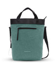 Flat front view of Sherpani's Anti-Theft bag, the Geo AT in Teal, with vegan leather accents in black. The bag features short tote handles and an adjustable/detachable crossbody strap. There is a locking zipper compartment on the front. A chair loop lock is clipped to the side and secured in place by an elastic tab.