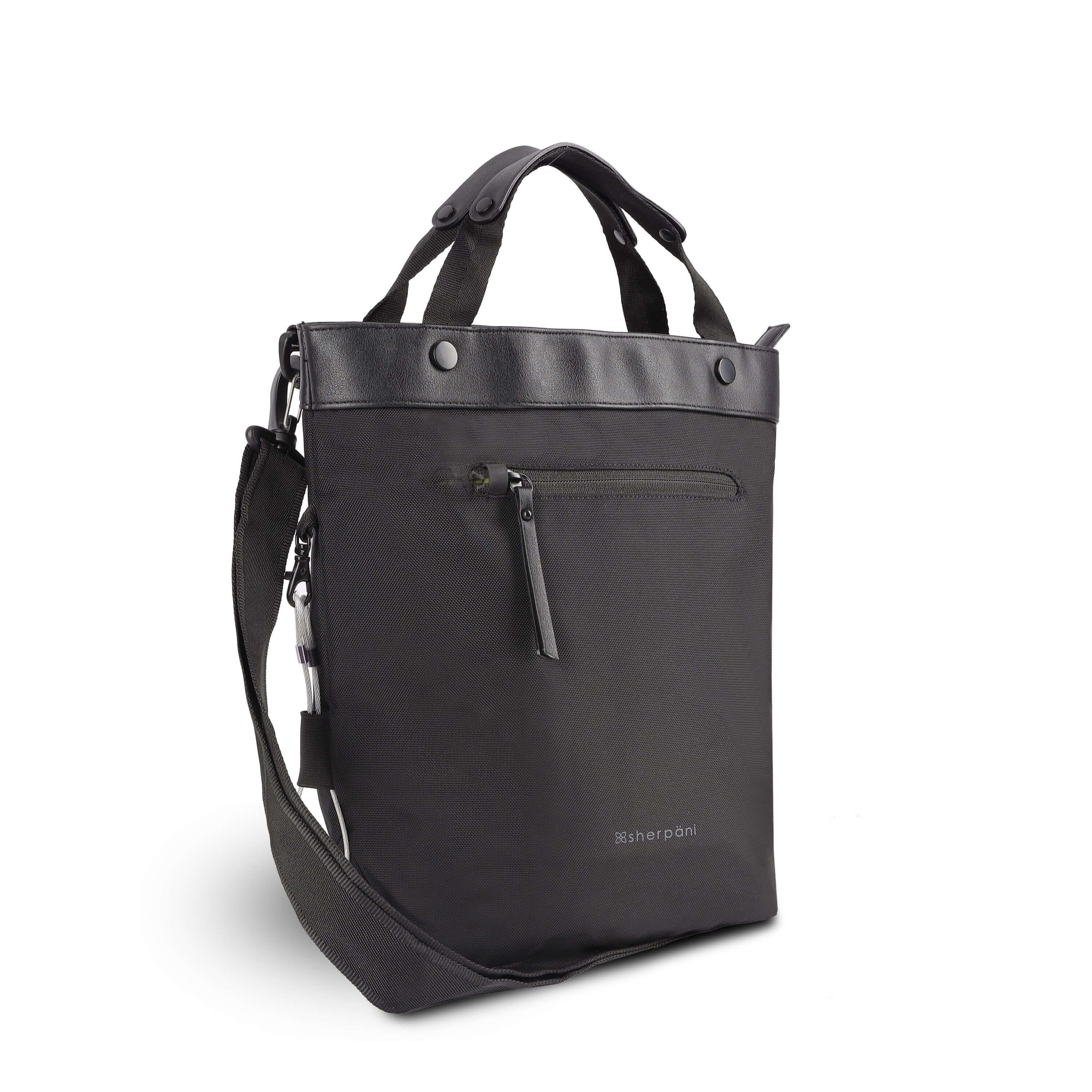 Angled front view of Sherpani&#39;s Anti-Theft bag, the Geo AT in Carbon, with vegan leather accents in black. The bag features short tote handles and an adjustable/detachable crossbody strap. There is a locking zipper compartment on the front. A chair loop lock is clipped to the side and secured in place by an elastic tab.