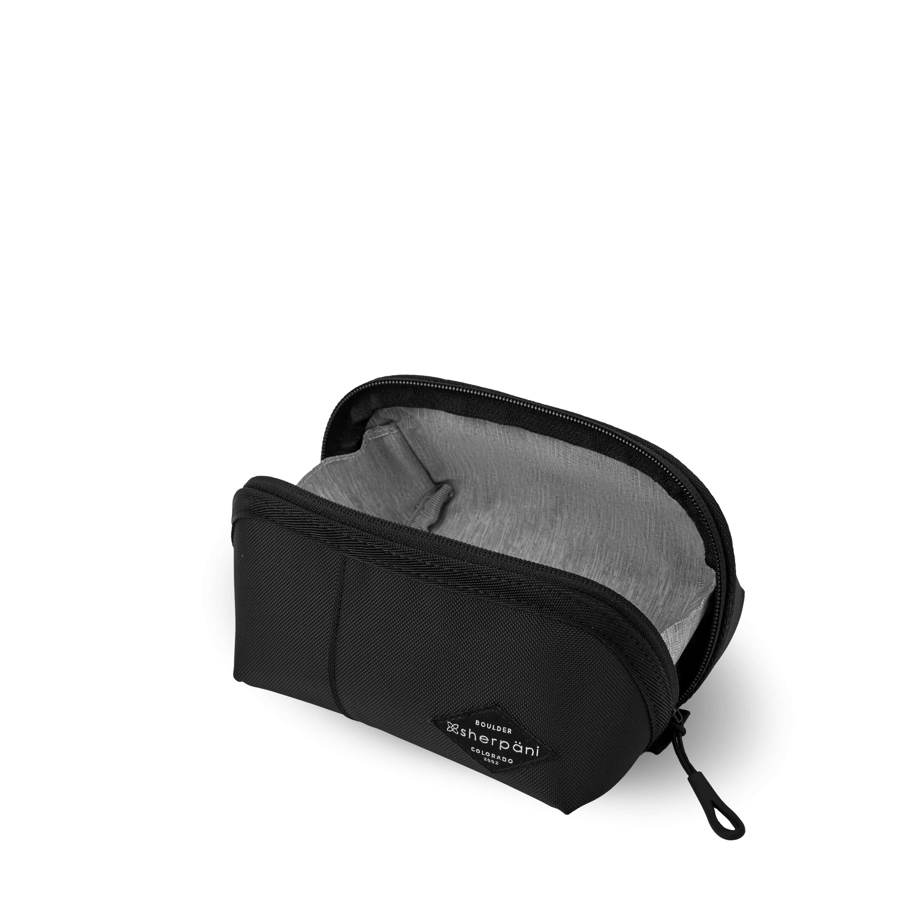 Top view of Sherpani travel accessory the Harmony in Raven. The pouch is unzipped to reveal a light gray interior.