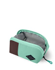 Top view of Sherpani travel accessory the Harmony in Seagreen. The pouch is unzipped to reveal a light gray interior.