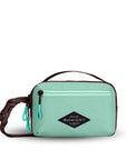 Front front view of Sherpani’s fanny pack, the Hyk in Seagreen. The bag is two-toned, the front half is light green and the back half is brown. There is an external zipper pocket on the front of the bag. Easy-pull zippers are accented in light green. The fanny pack features an adjustable strap with a buckle.