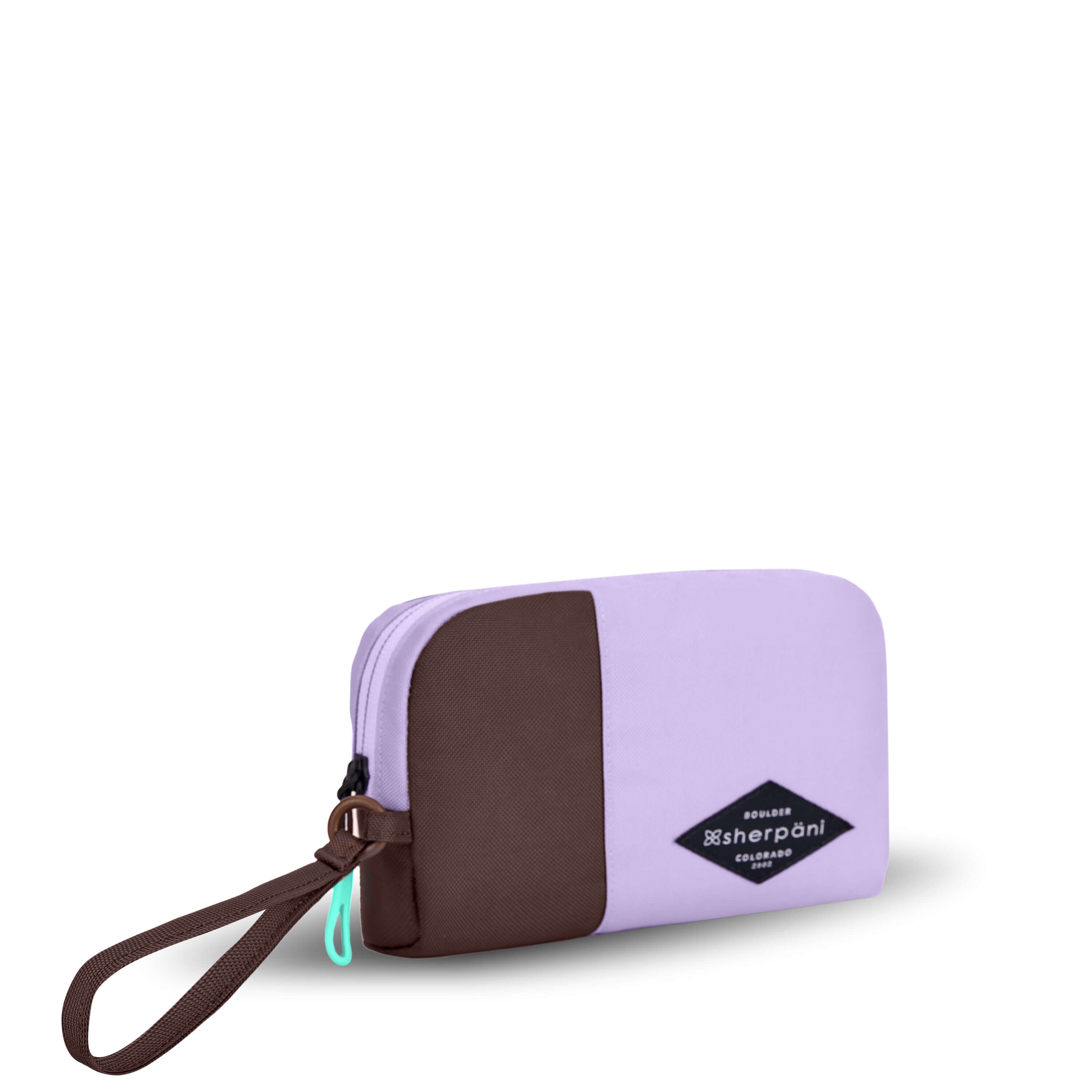 Angled front view of Sherpani travel accessory, the Jolie in Lavender, in small size. The pouch is two-toned in lavender and brown. It features a brown wristlet strap and an easy-pull zipper accented in aqua.
