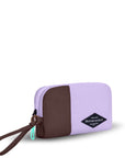 Angled front view of Sherpani travel accessory, the Jolie in Lavender, in medium size. The pouch is two-toned in lavender and brown. It features a brown wristlet strap and an easy-pull zipper accented in aqua.
