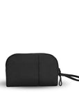Back view of Sherpani travel accessory, the Jolie in Raven, in medium size. The pouch is entirely black. It features a black wristlet strap and an easy-pull zipper accented in black.