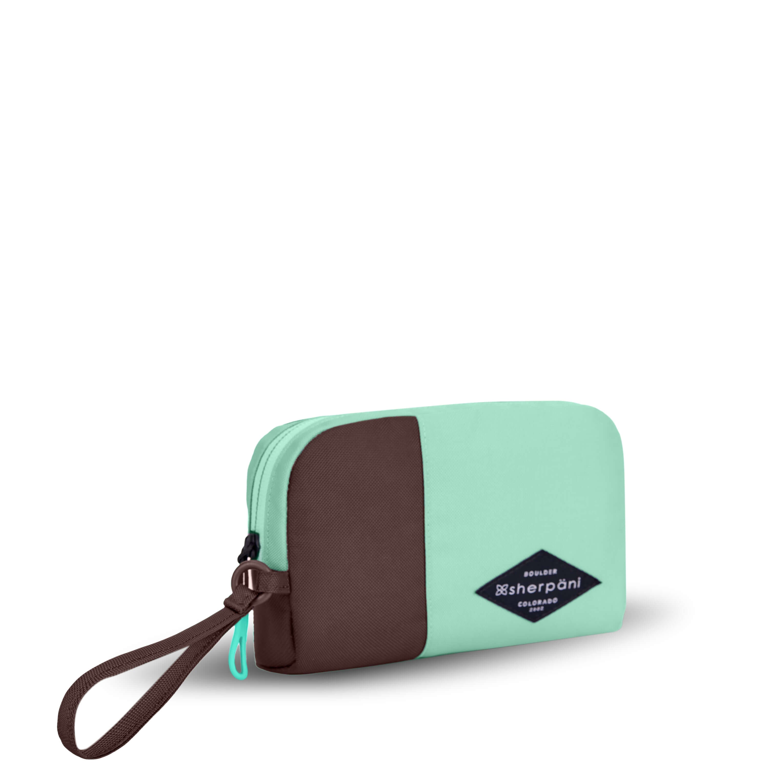 Angled front view of Sherpani travel accessory, the Jolie in Seagreen, in medium size. The pouch is two-toned in light green and brown. It features a brown wristlet strap and an easy-pull zipper accented in light green.