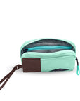 Top view of Sherpani travel accessory the Jolie in Seagreen, in medium size. The pouch is unzipped to reveal a light gray interior and internal zipper pocket.