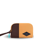 Flat front view of Sherpani travel accessory, the Jolie in Sundial, in small size. The pouch is two-toned in burnt yellow and brown. It features a brown wristlet strap and an easy-pull zipper accented in aqua.