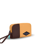 Angled front view of Sherpani travel accessory, the Jolie in Sundial, in medium size. The pouch is two-toned in burnt yellow and brown. It features a brown wristlet strap and an easy-pull zipper accented in aqua.